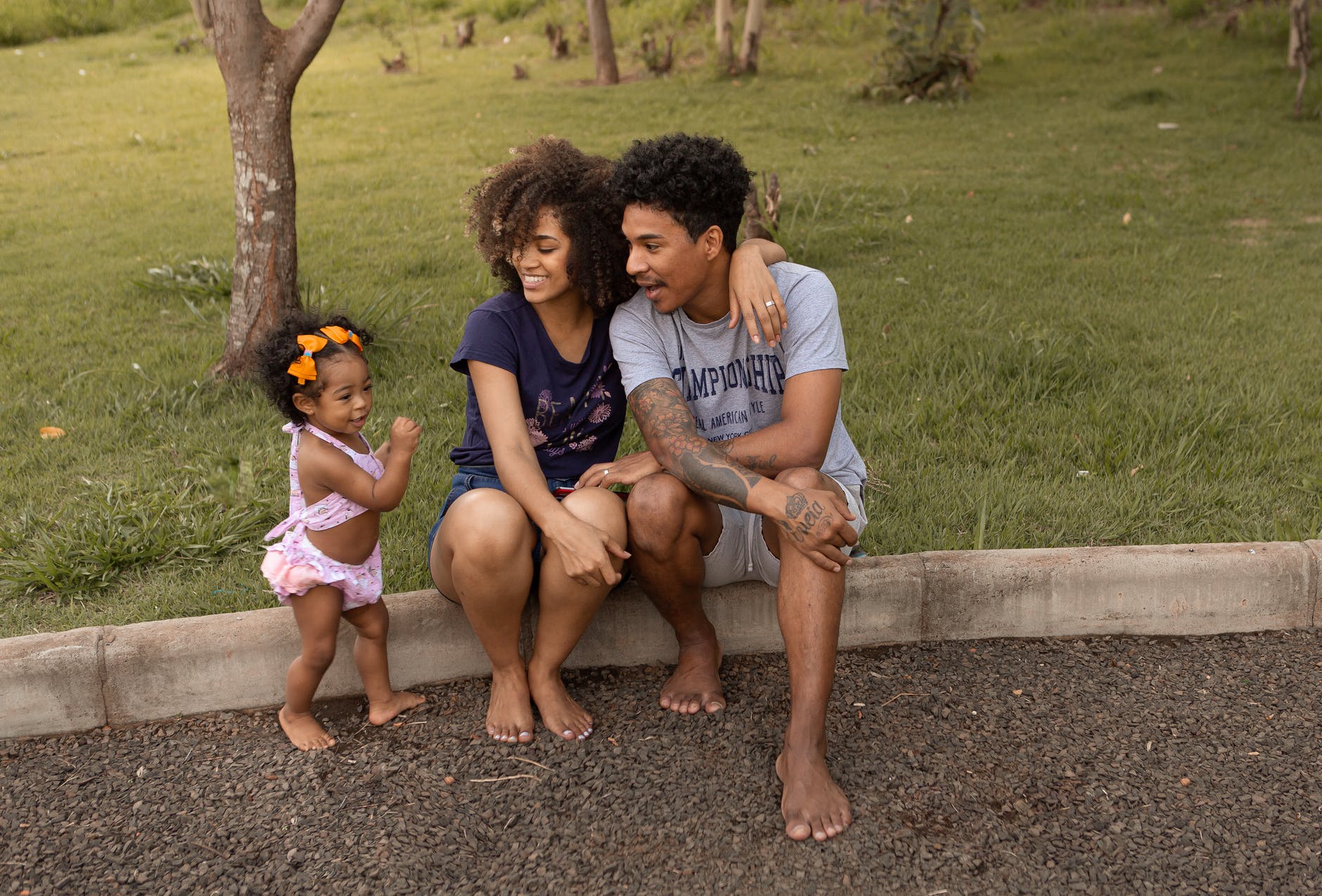 happy black family near lawn with green grass