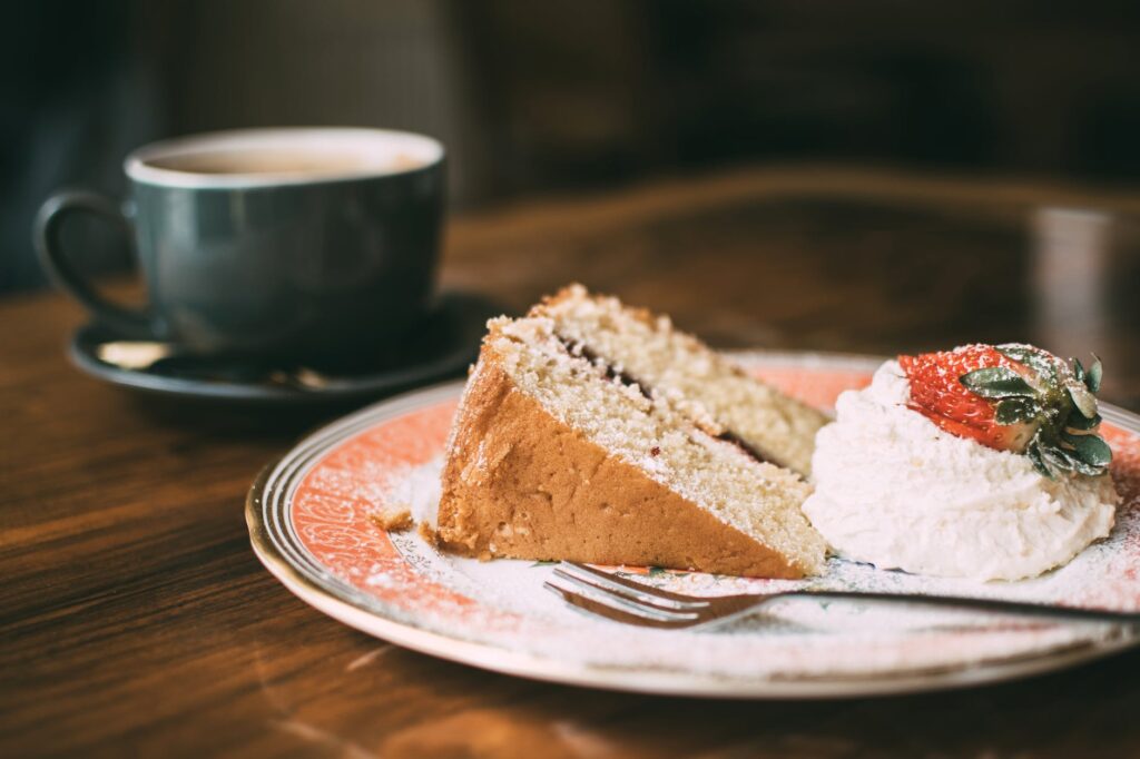 photo of sliced cake on ceramic plate