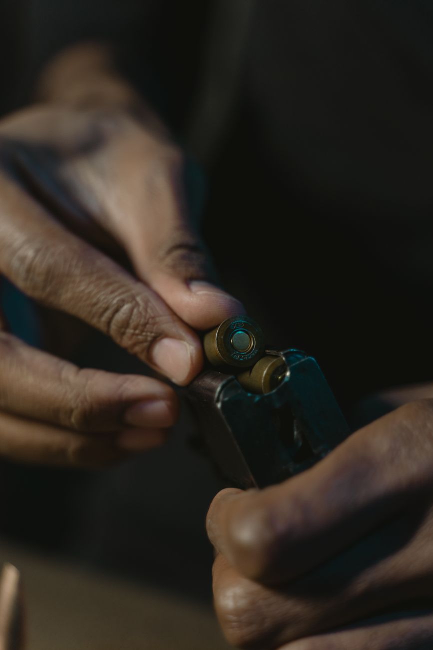 hand loading bullet in a gun magazine