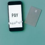 black smartphone on green background