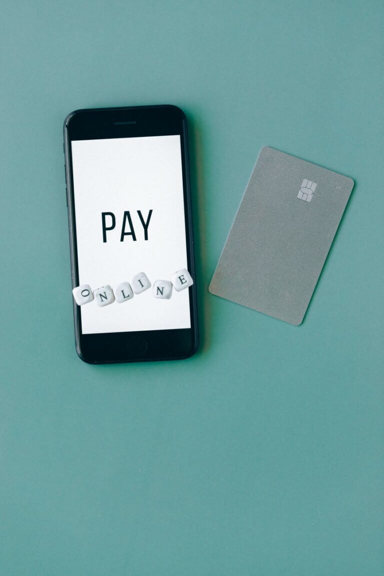black smartphone on green background