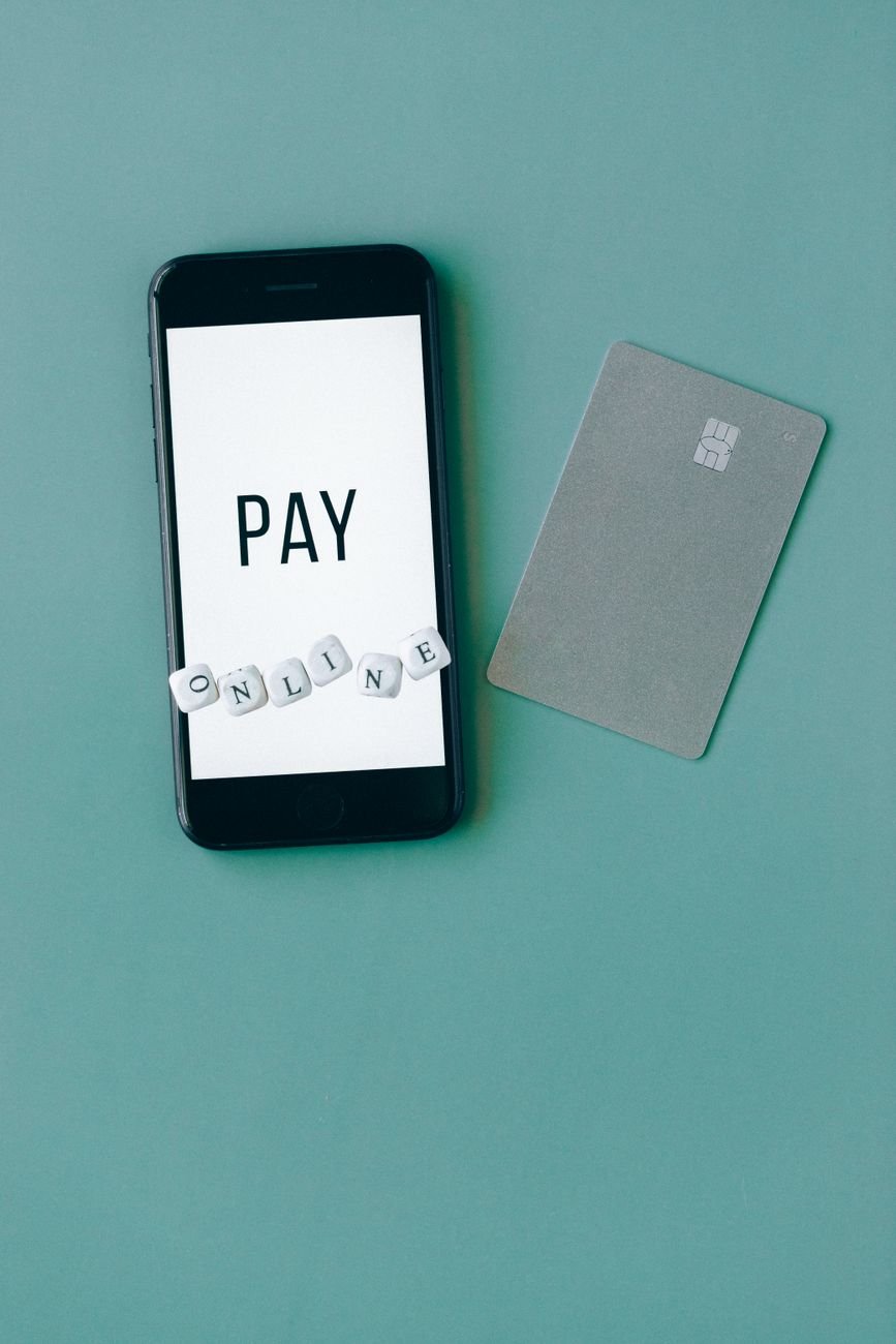 black smartphone on green background