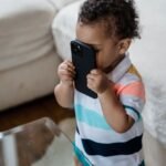 child holding a smartphone