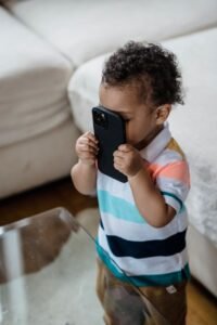 child holding a smartphone