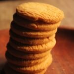 stack of homemade shortbread cookies on wooden board